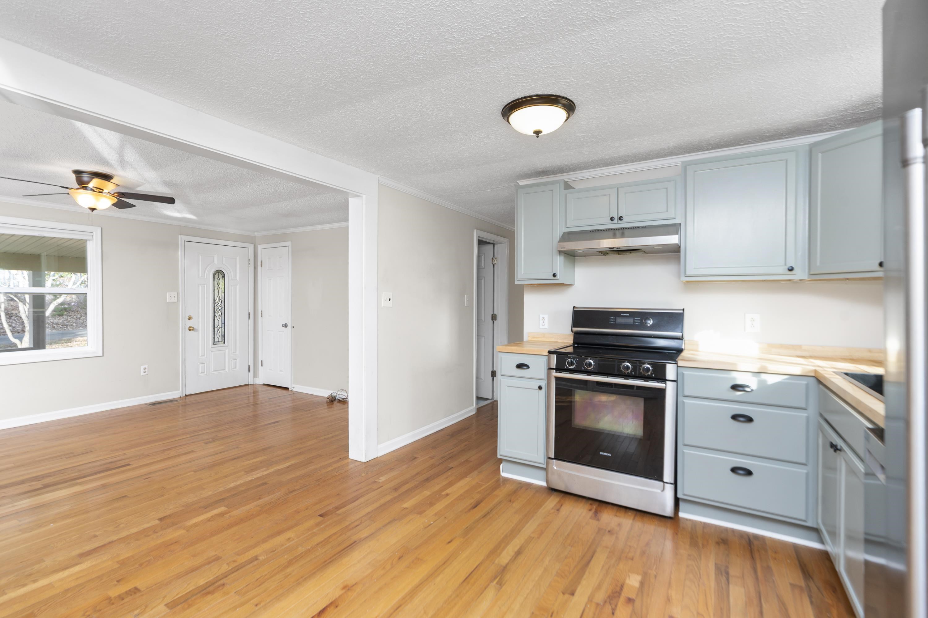 7081 Secretarys Sand Road Schuyler, VA 22969 - Photo 7 of 65 a kitchen with granite countertop a stove and a sink