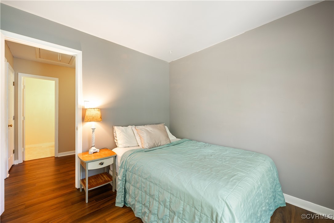 15221 Windy Ridge Road Midlothian, VA 23112 - Photo 12 of 30 a bedroom with a bed and wooden floor