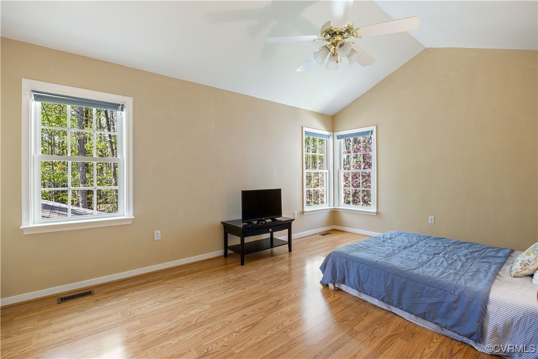 15221 Windy Ridge Road Midlothian, VA 23112 - Photo 14 of 30 a living room with a bed furniture and a window