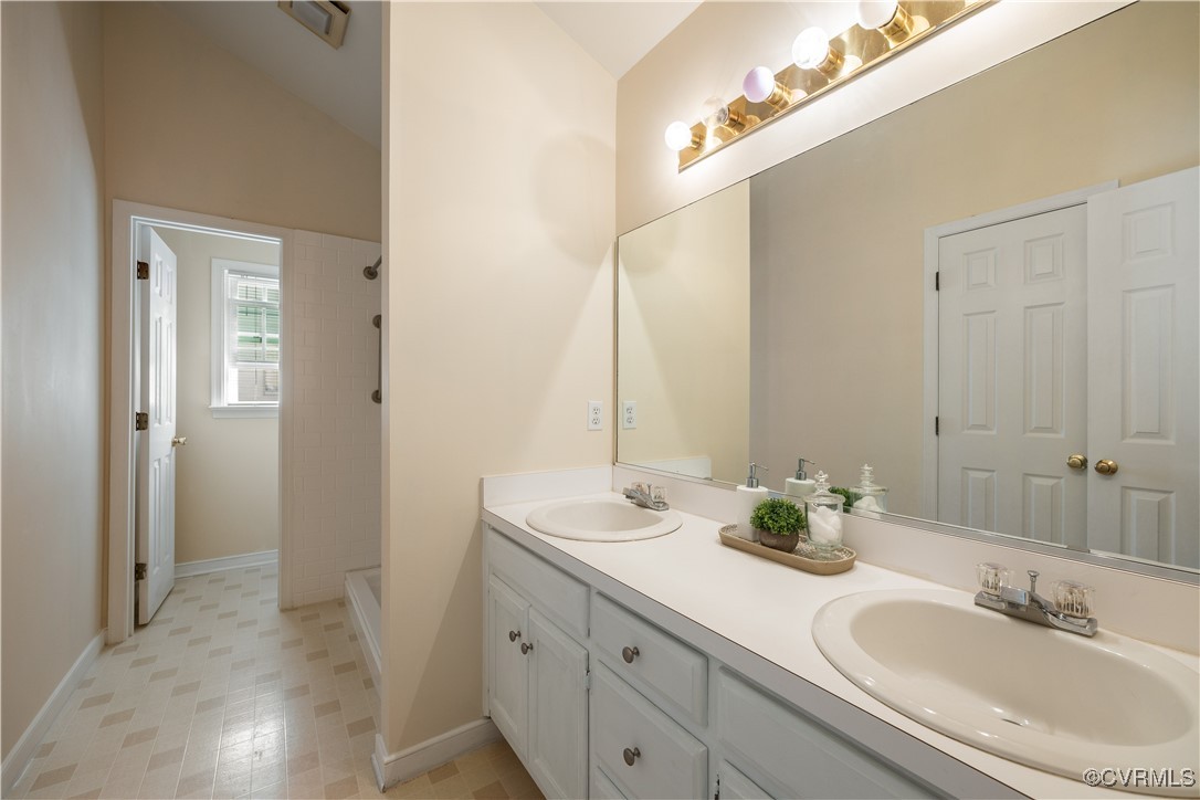 15221 Windy Ridge Road Midlothian, VA 23112 - Photo 16 of 30 a bathroom with a sink and a mirror