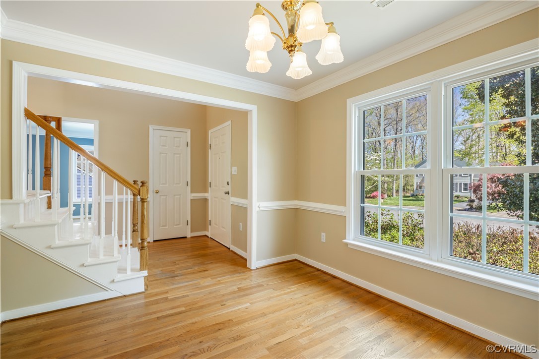 15221 Windy Ridge Road Midlothian, VA 23112 - Photo 2 of 30 a view of an entryway with wooden floor and windows