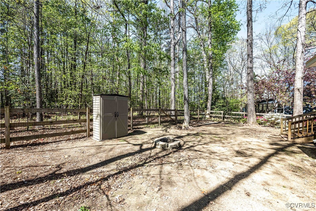 15221 Windy Ridge Road Midlothian, VA 23112 - Photo 21 of 30 a view of a backyard with large trees