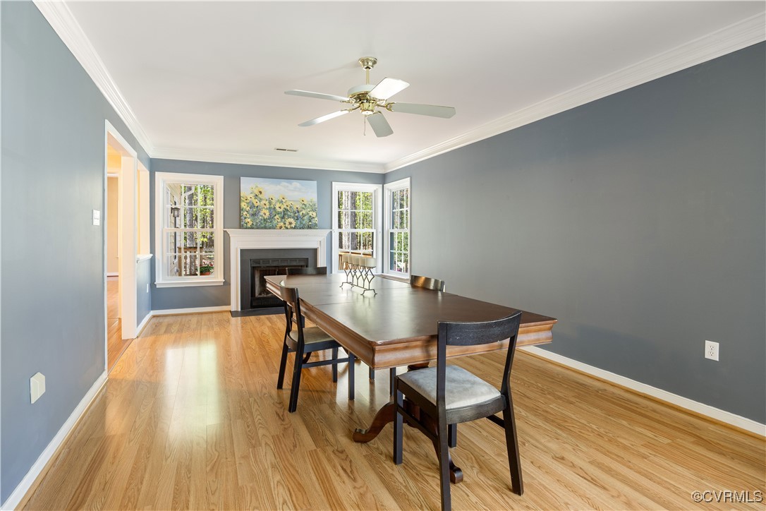 15221 Windy Ridge Road Midlothian, VA 23112 - Photo 4 of 30 a view of a dining room with furniture window and wooden floor