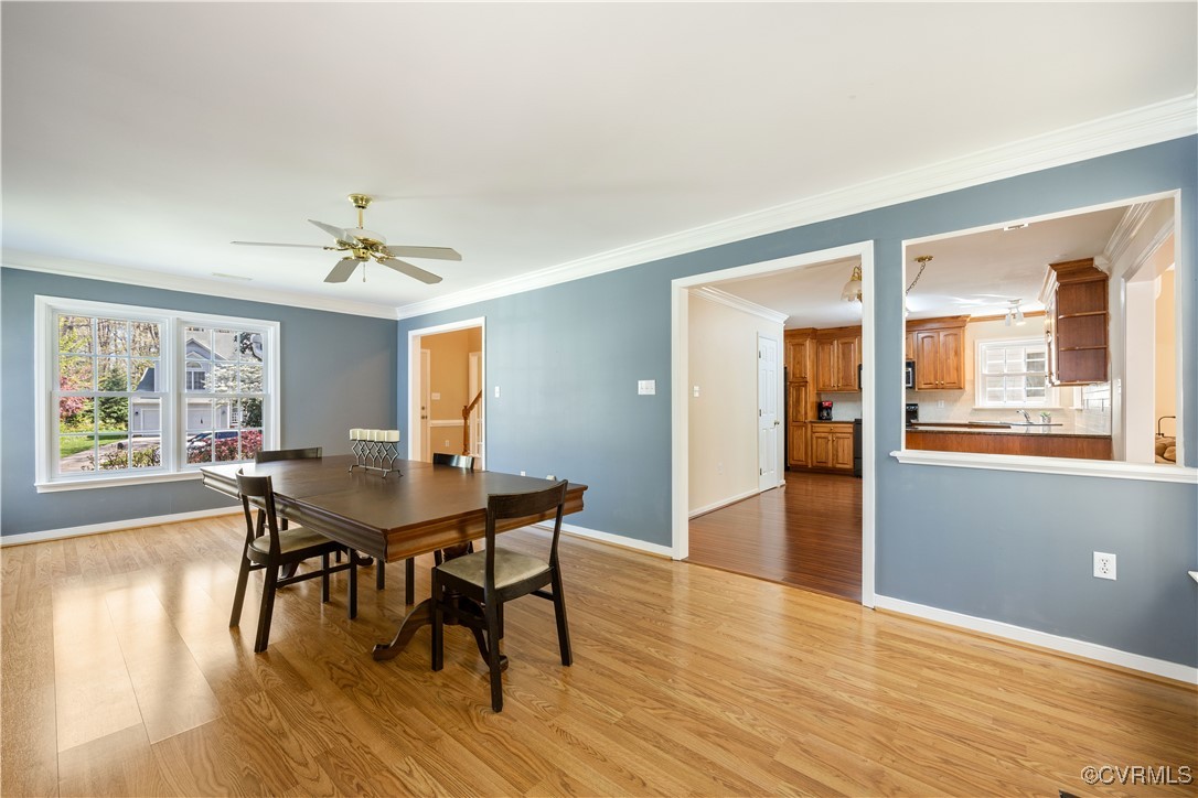 15221 Windy Ridge Road Midlothian, VA 23112 - Photo 5 of 30 a view of a dining room with furniture and wooden floor