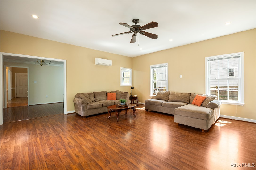 15221 Windy Ridge Road Midlothian, VA 23112 - Photo 10 of 30 a living room with furniture and a wooden floor