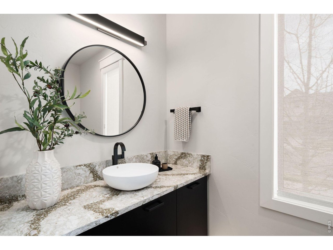 2311 Sugarloaf Road Berthoud, CO 80513 - Photo 15 of 49 a bathroom with a sink and a mirror