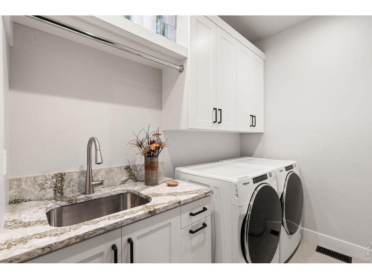 2311 Sugarloaf Road Berthoud, CO 80513 - Photo 17 of 49 a view of kitchen sink washer and dryer