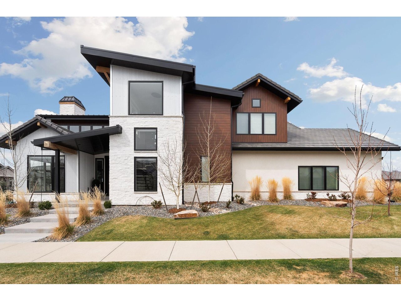 2311 Sugarloaf Road Berthoud, CO 80513 - Photo 2 of 49 a front view of a house with a yard