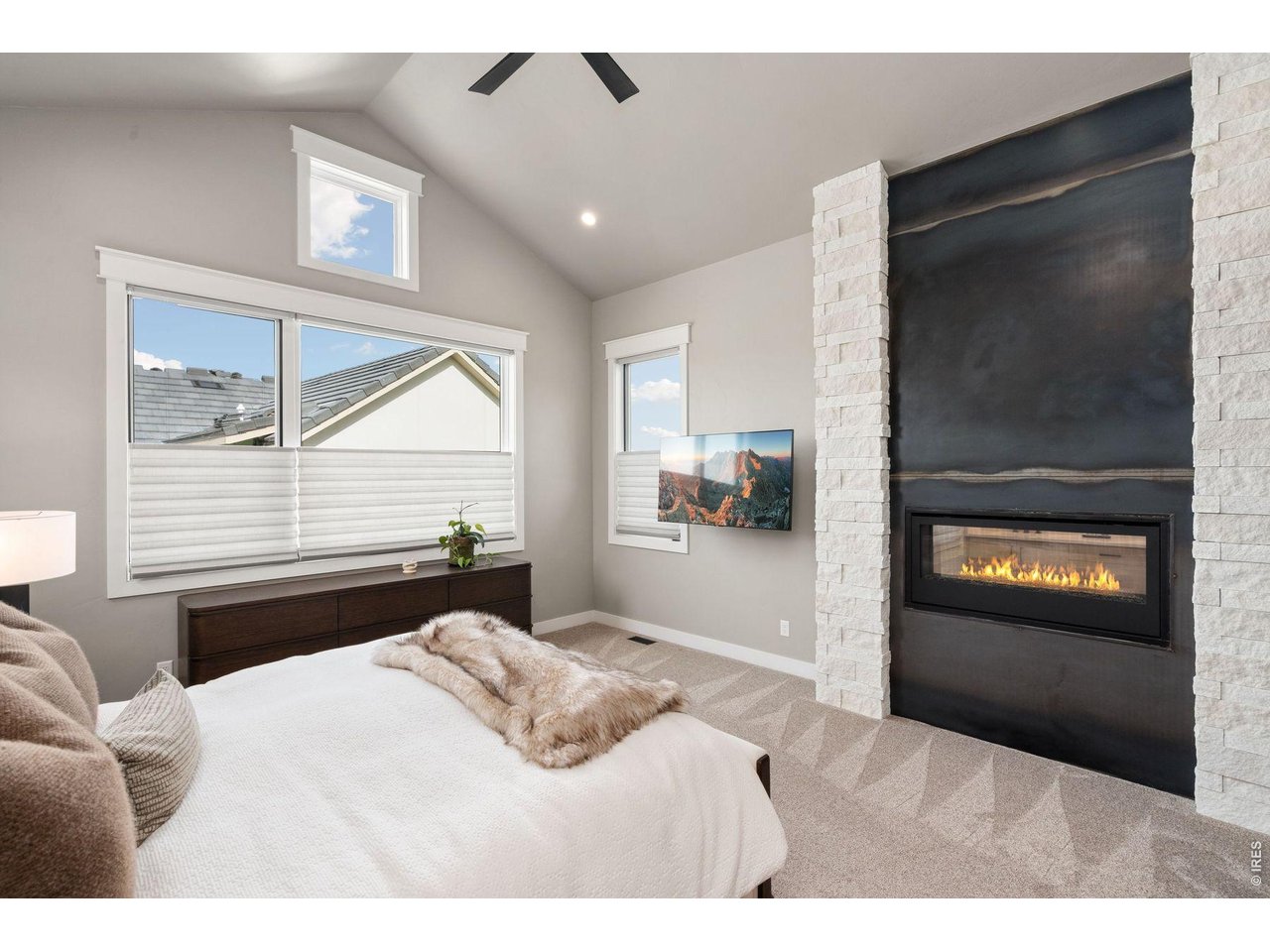 2311 Sugarloaf Road Berthoud, CO 80513 - Photo 22 of 49 a bedroom with a bed and a television