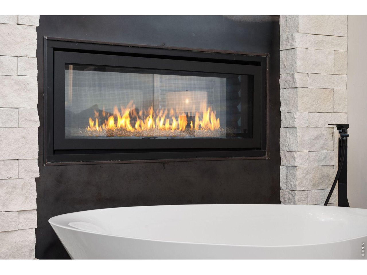 2311 Sugarloaf Road Berthoud, CO 80513 - Photo 24 of 49 a black and white view of a fireplace