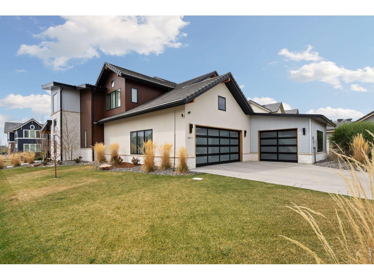 2311 Sugarloaf Road Berthoud, CO 80513 - Photo 49 of 49 a view of a house with a patio and a yard