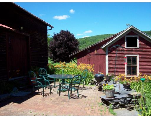 8 Charlemont Road Buckland, MA 01338 - Photo 8 of 10 a backyard of a house with a yard and outdoor seating
