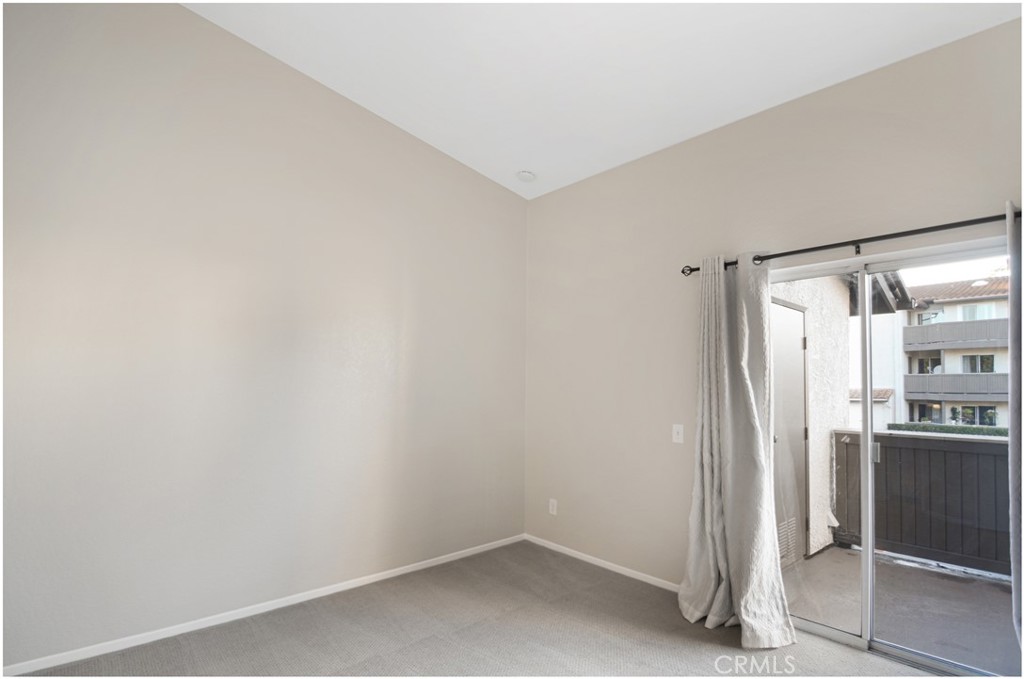 18 Corniche Drive, Unit E Dana Point, CA 92629 - Photo 13 of 38 a room that has a refrigerator in it