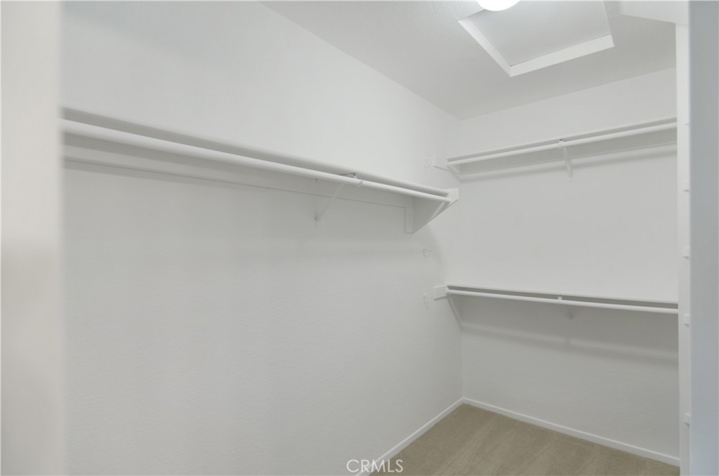 18 Corniche Drive, Unit E Dana Point, CA 92629 - Photo 17 of 38 a view of an empty walk in closet