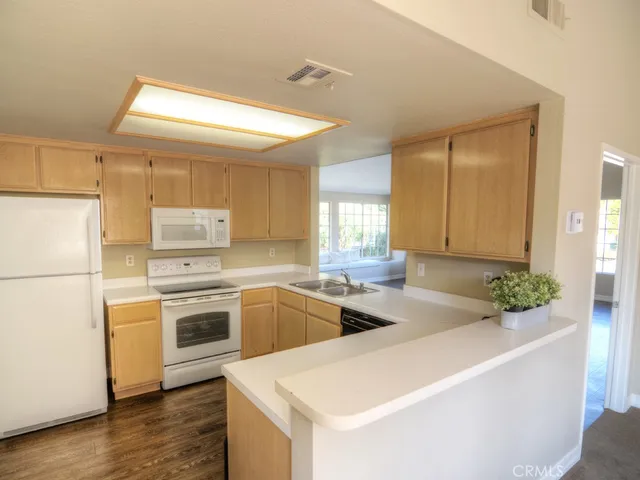 a kitchen that has a sink and a stove in it