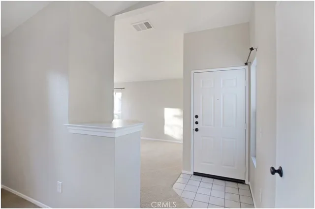 a view of a hallway with two rooms
