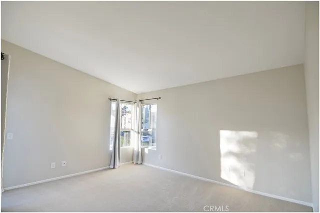 a big room with windows and closet