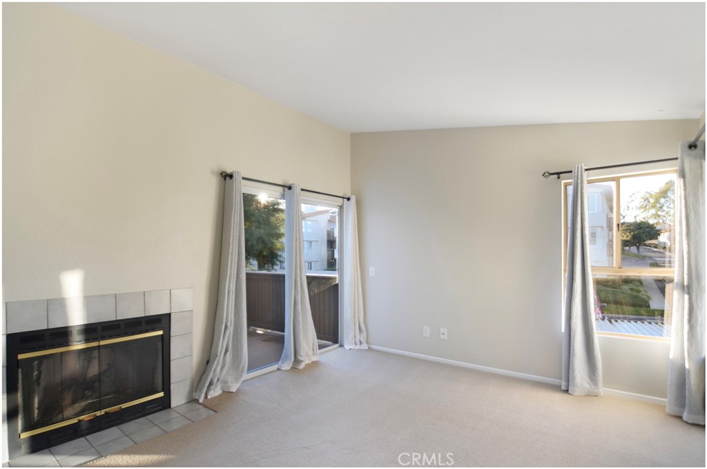 18 Corniche Drive, Unit E Dana Point, CA 92629 - Photo 6 of 38 a view of an empty room with a fireplace
