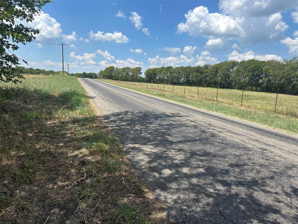 Lot 1 Rutledge Road Whitewright, TX 75491 - Photo 7 of 12 a view of a field with large trees