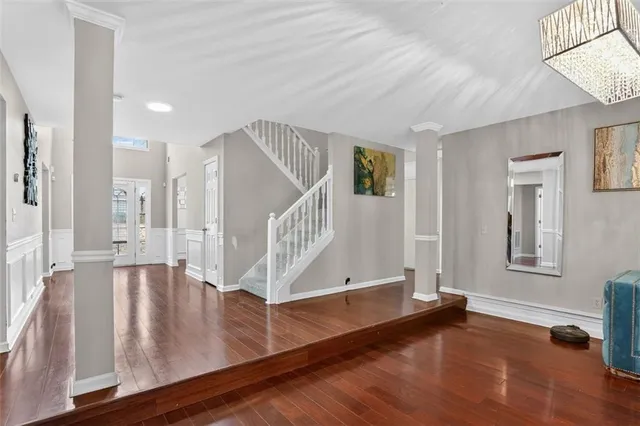 a view of an entryway with wooden floor
