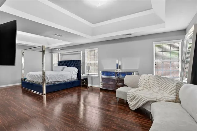 a bedroom with a bed and a couch