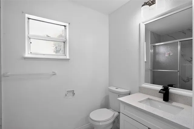 a bathroom with a tub and shower