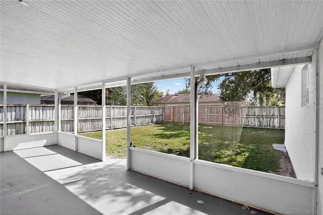 a view of a backyard with a fence