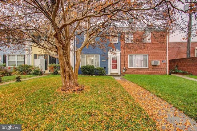 a house with huge green field in front of it