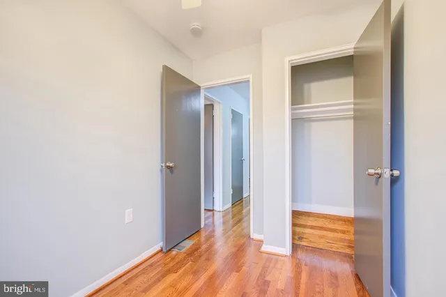a view of a dining room with furniture and a chandelier