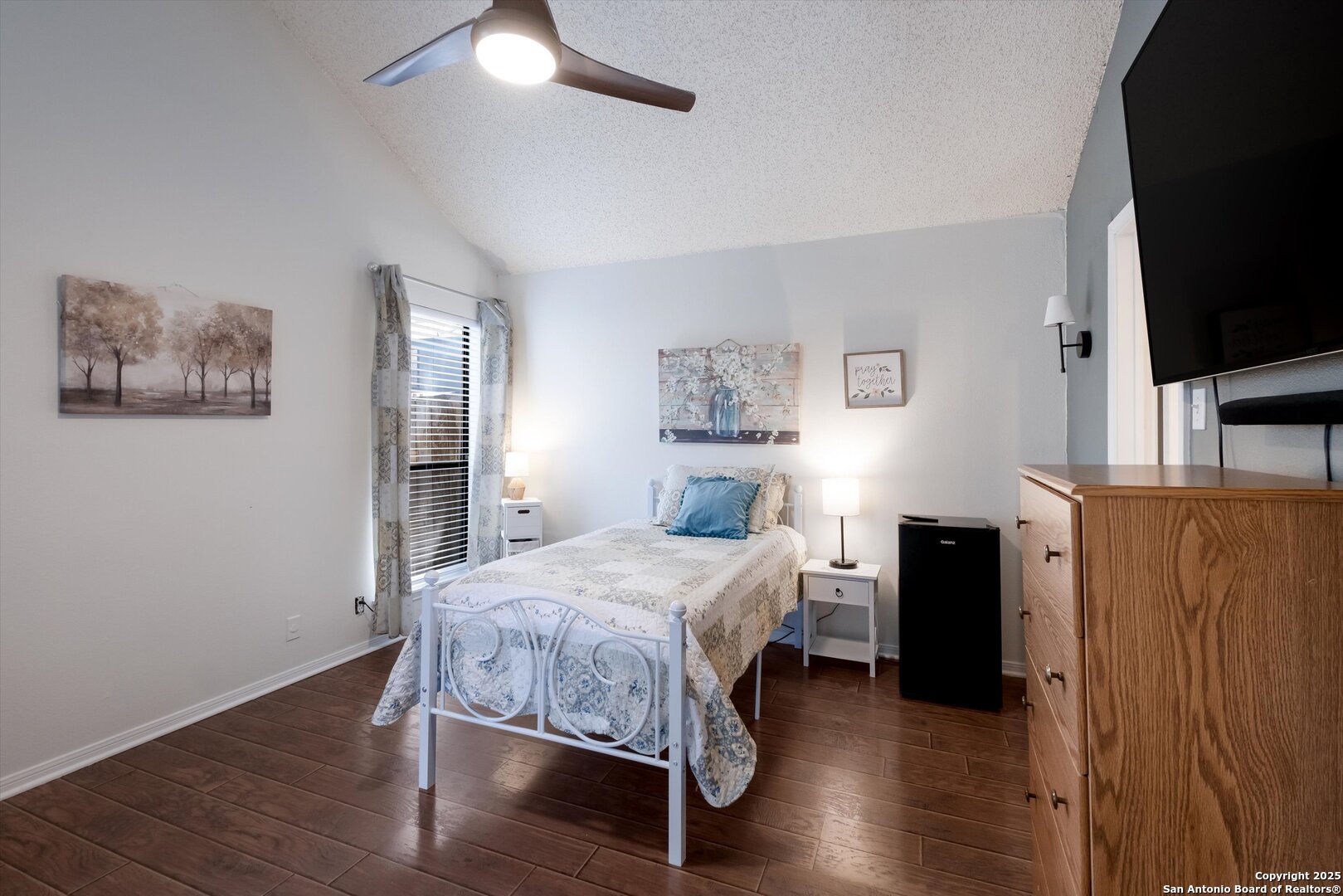 5738 Spring Sunshine San Antonio, TX 78247 - Photo 11 of 22 a bedroom with a bed and a flat screen tv