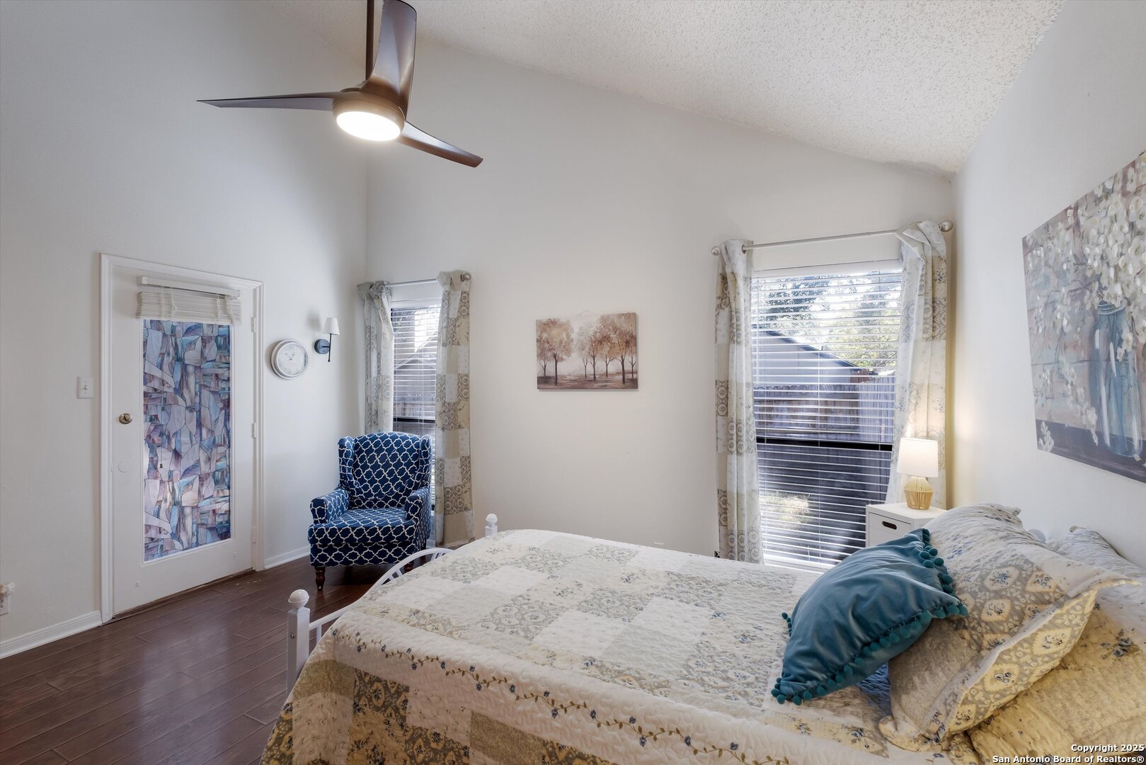 5738 Spring Sunshine San Antonio, TX 78247 - Photo 12 of 22 a bedroom with a bed and wooden floor