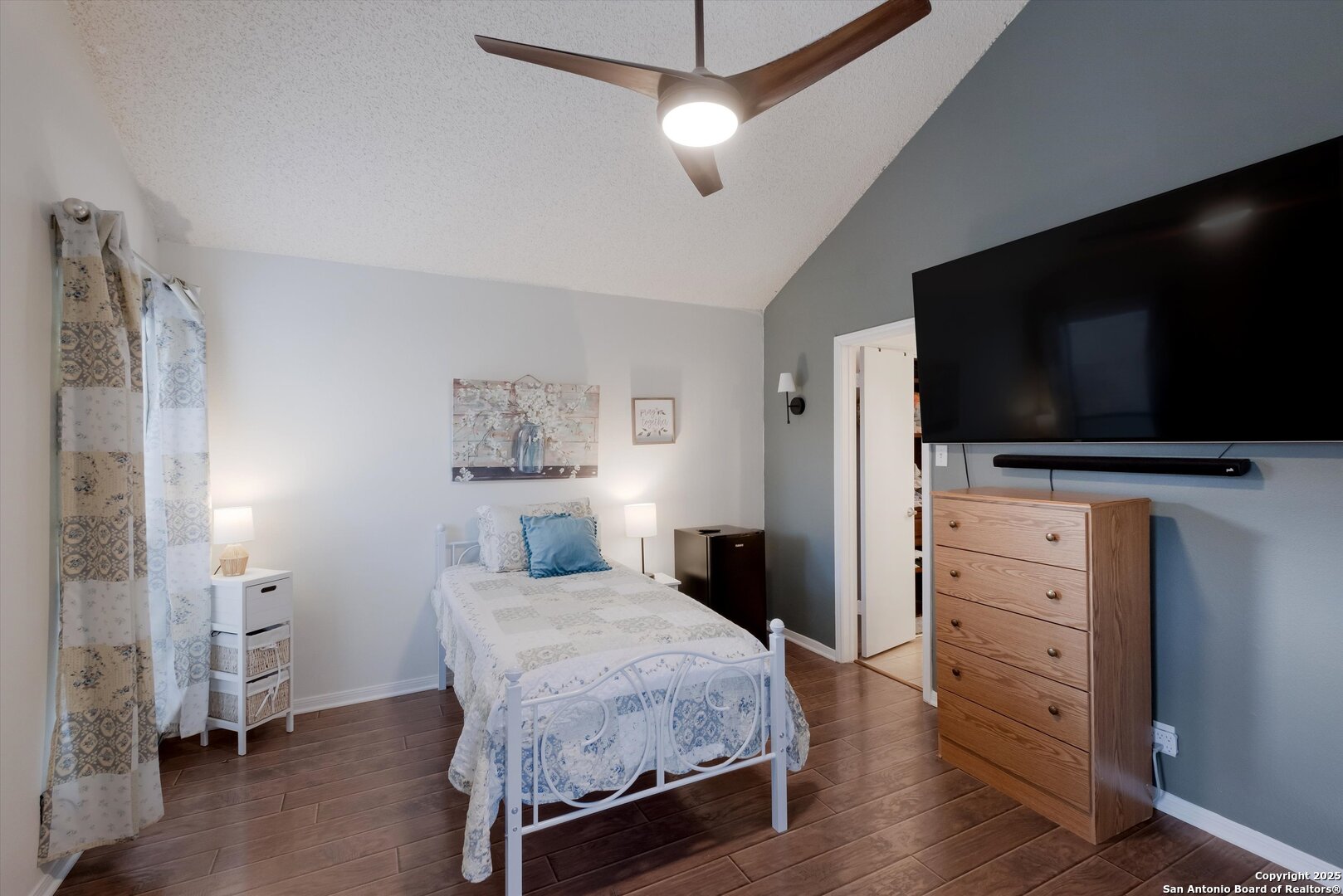 5738 Spring Sunshine San Antonio, TX 78247 - Photo 13 of 22 a bedroom with a bed and a flat screen tv