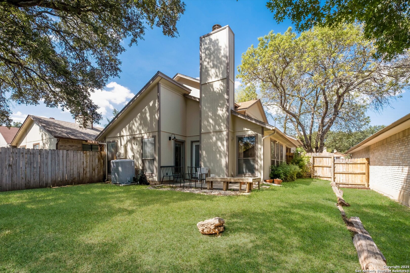 5738 Spring Sunshine San Antonio, TX 78247 - Photo 22 of 22 a front view of a house with garden