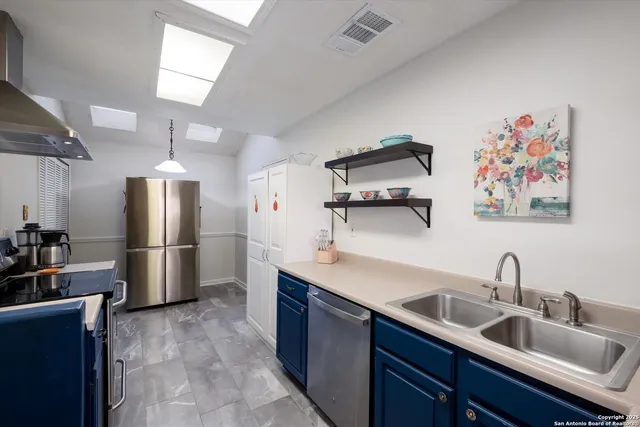 a kitchen with a stove and a sink