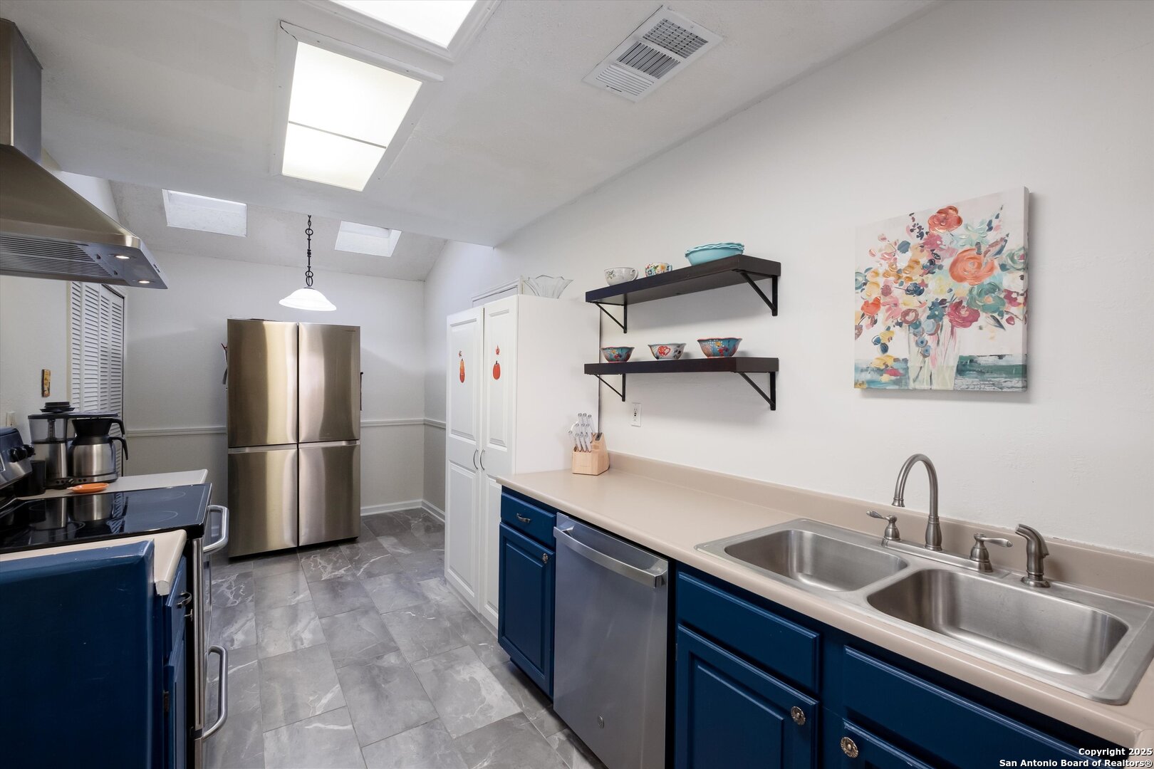 5738 Spring Sunshine San Antonio, TX 78247 - Photo 7 of 22 a kitchen with stainless steel appliances granite countertop a sink refrigerator and microwave