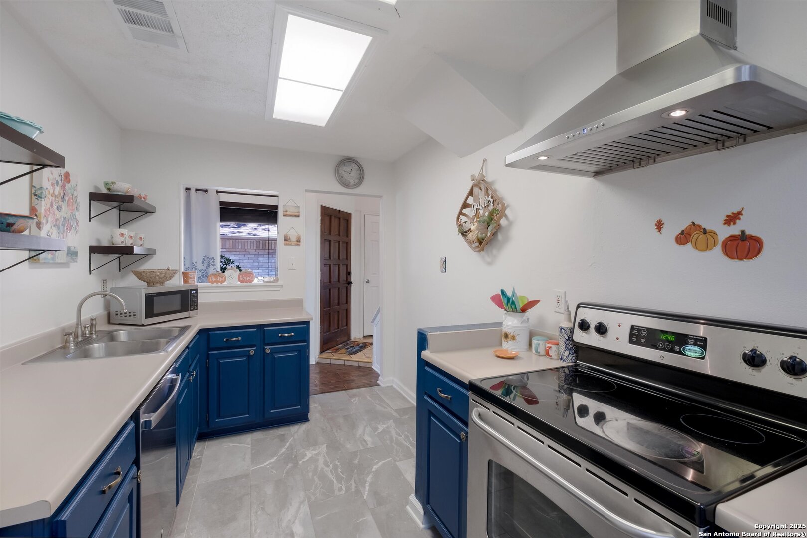 5738 Spring Sunshine San Antonio, TX 78247 - Photo 9 of 22 a kitchen with a stove and a sink