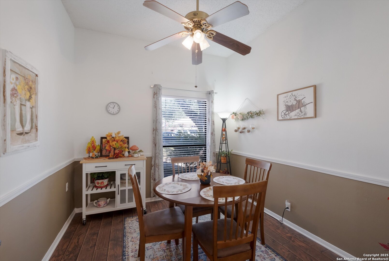 5738 Spring Sunshine San Antonio, TX 78247 - Photo 10 of 22 a view of a dining room with furniture and wooden floor