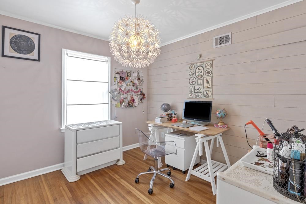 5218 Quince Road Memphis, TN 38117 - Photo 17 of 25 a work room with furniture and a chandelier