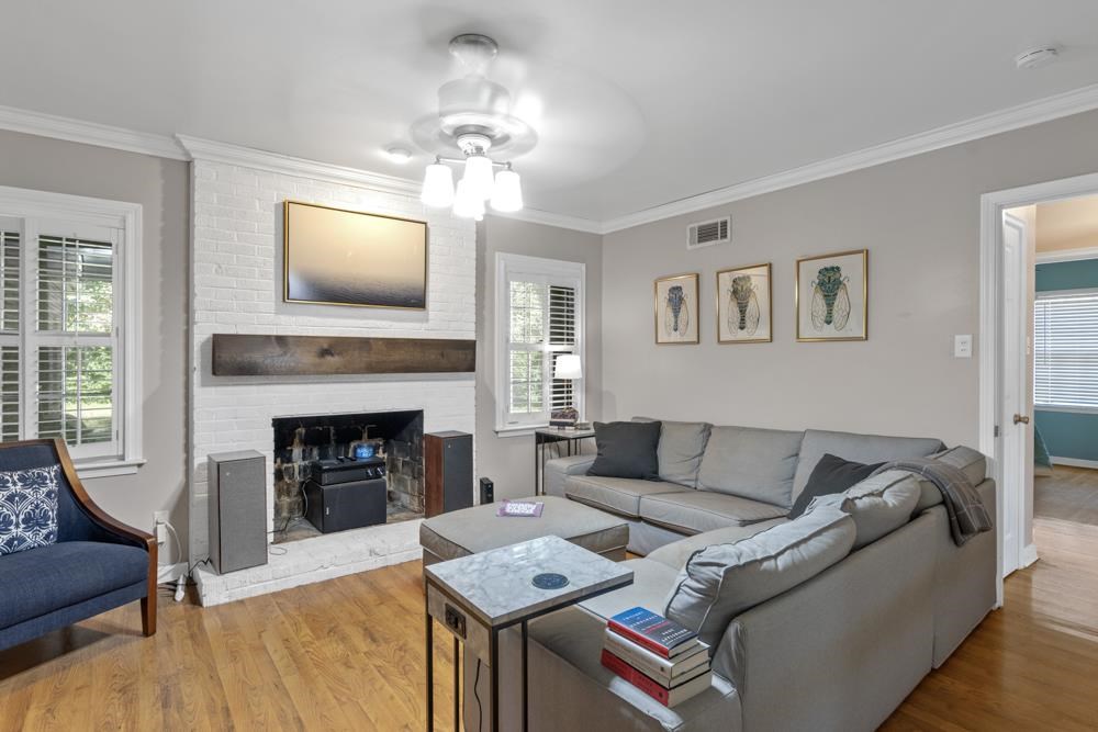 5218 Quince Road Memphis, TN 38117 - Photo 3 of 25 a living room with furniture and a fireplace
