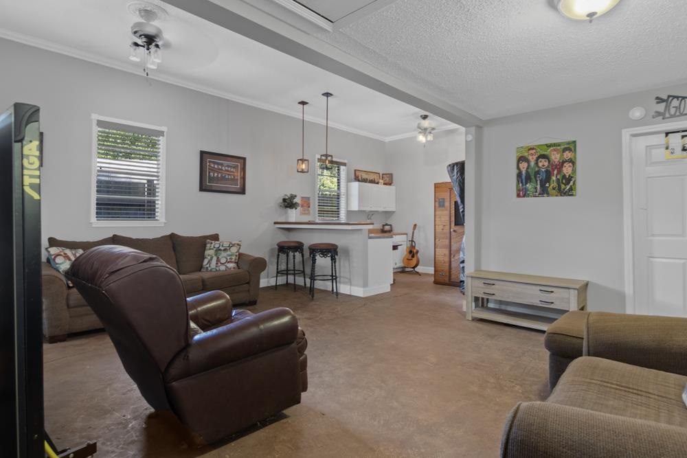 5218 Quince Road Memphis, TN 38117 - Photo 21 of 25 a living room with furniture and a flat screen tv