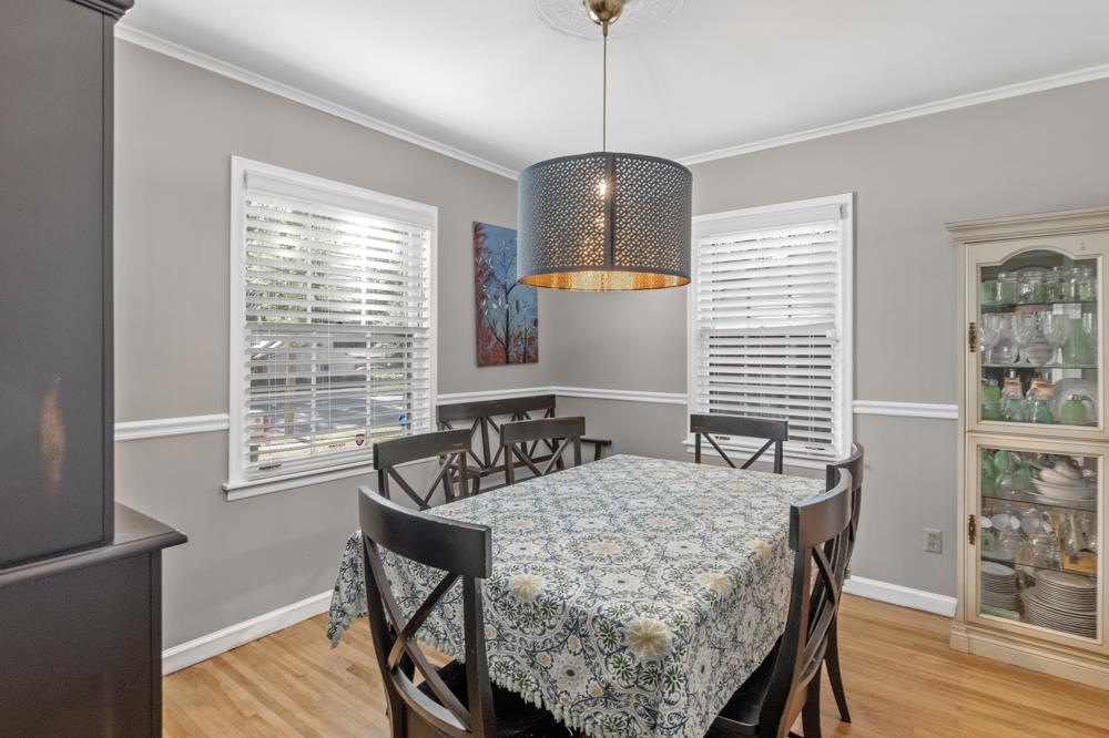5218 Quince Road Memphis, TN 38117 - Photo 6 of 25 a view of a dining room with furniture window and wooden floor
