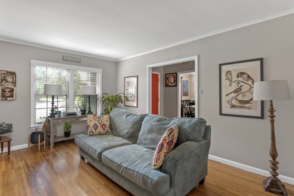 5218 Quince Road Memphis, TN 38117 - Photo 8 of 25 a living room with furniture and wooden floor