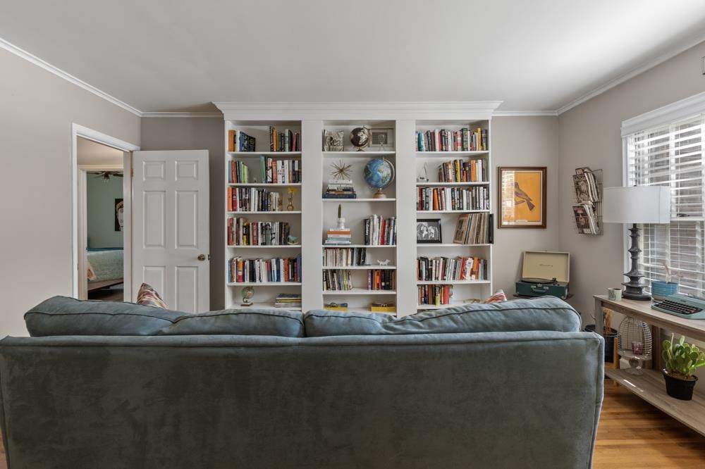 5218 Quince Road Memphis, TN 38117 - Photo 9 of 25 a living room with furniture and a book shelf
