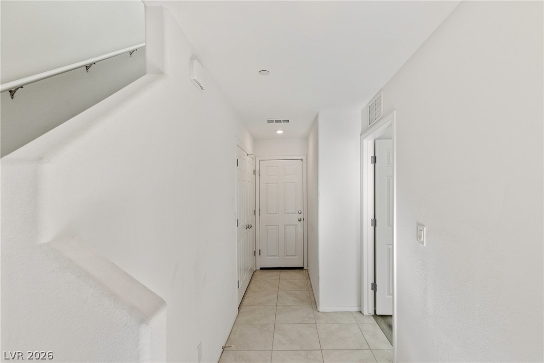 6227 Runestone Street Las Vegas, NV 89113 - Photo 3 of 33 This clean and inviting entryway provides a warm welcome with durable tile flooring and natural light.