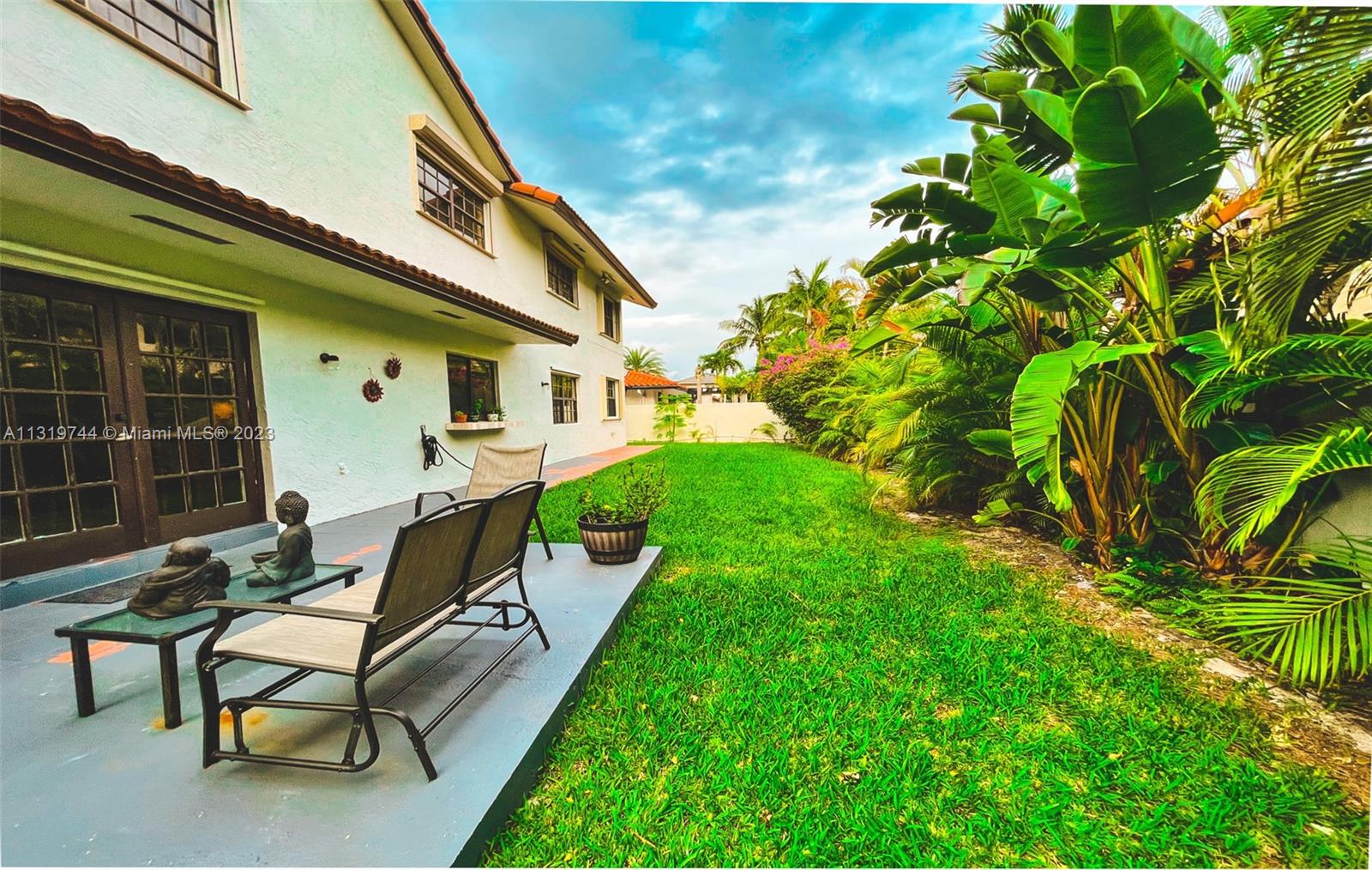 11990 Southwest 92nd Street Miami, FL 33186 - Photo 28 of 33 a view of a house with backyard and sitting area