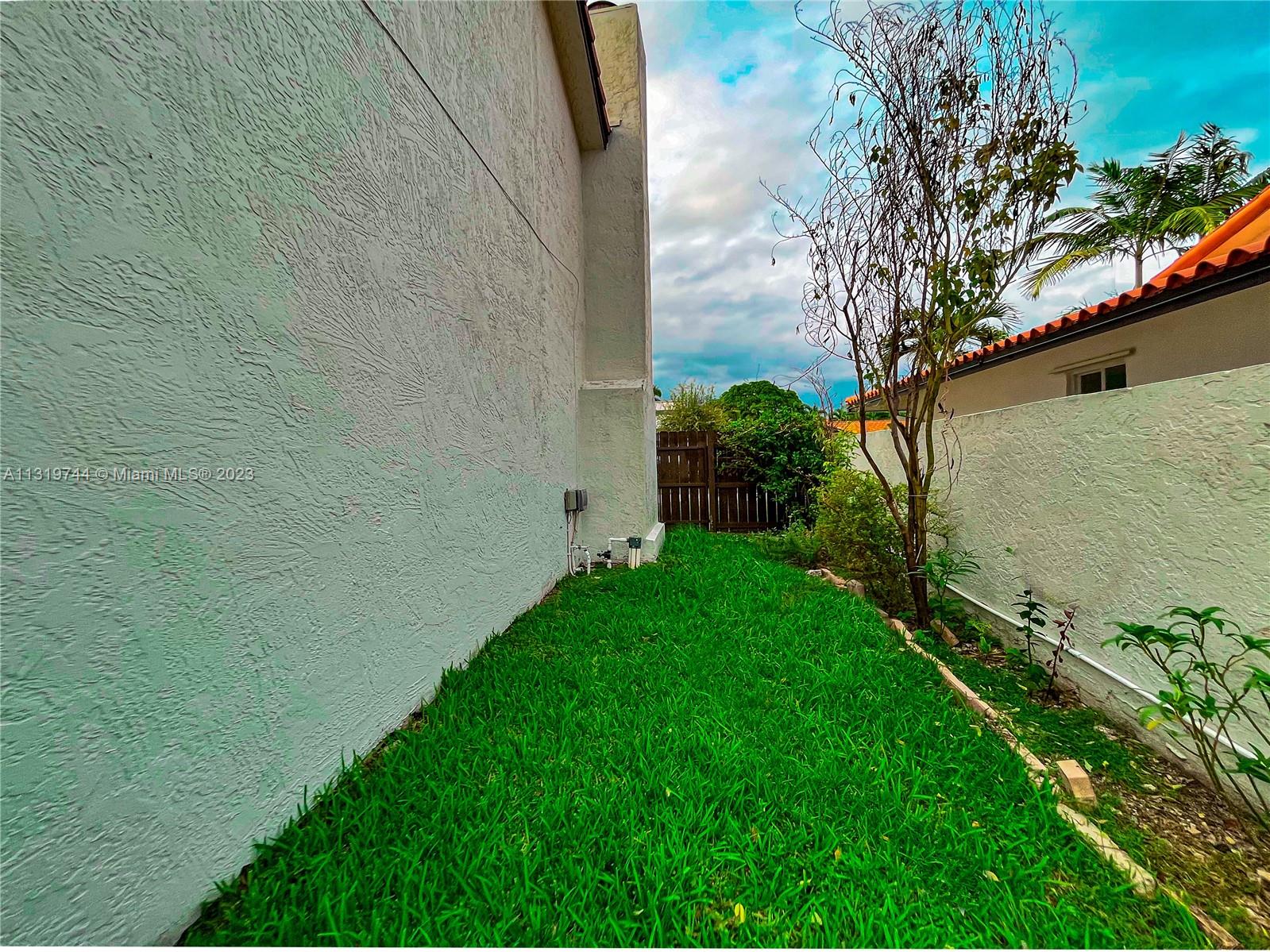 11990 Southwest 92nd Street Miami, FL 33186 - Photo 32 of 33 a view of an outdoor space and a yard