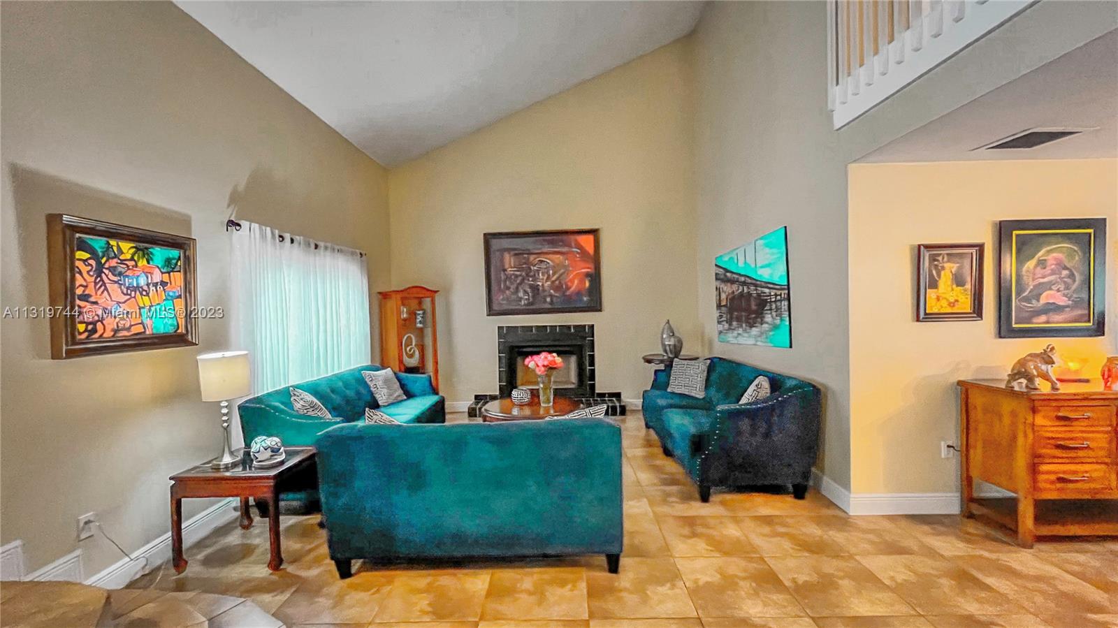 11990 Southwest 92nd Street Miami, FL 33186 - Photo 8 of 33 a living room with furniture and a flat screen tv