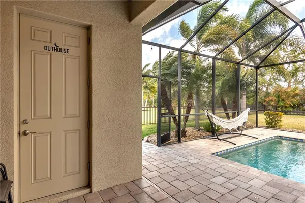 a view of a porch with a slide and potted plants