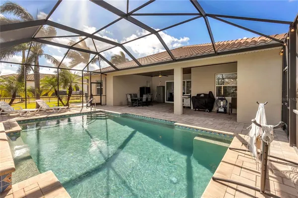 a view of a swimming pool with a patio