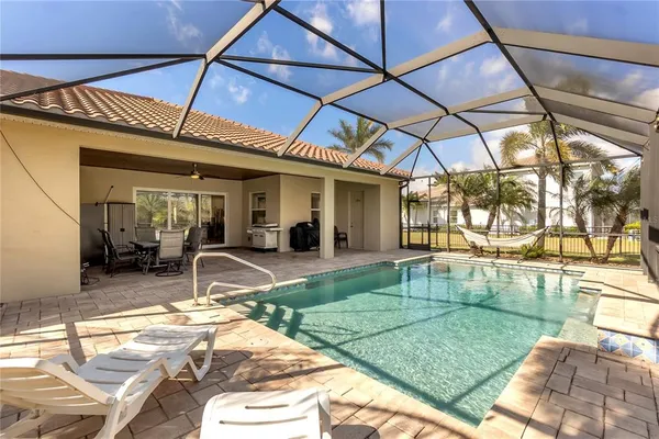 a view of a swimming pool with a patio